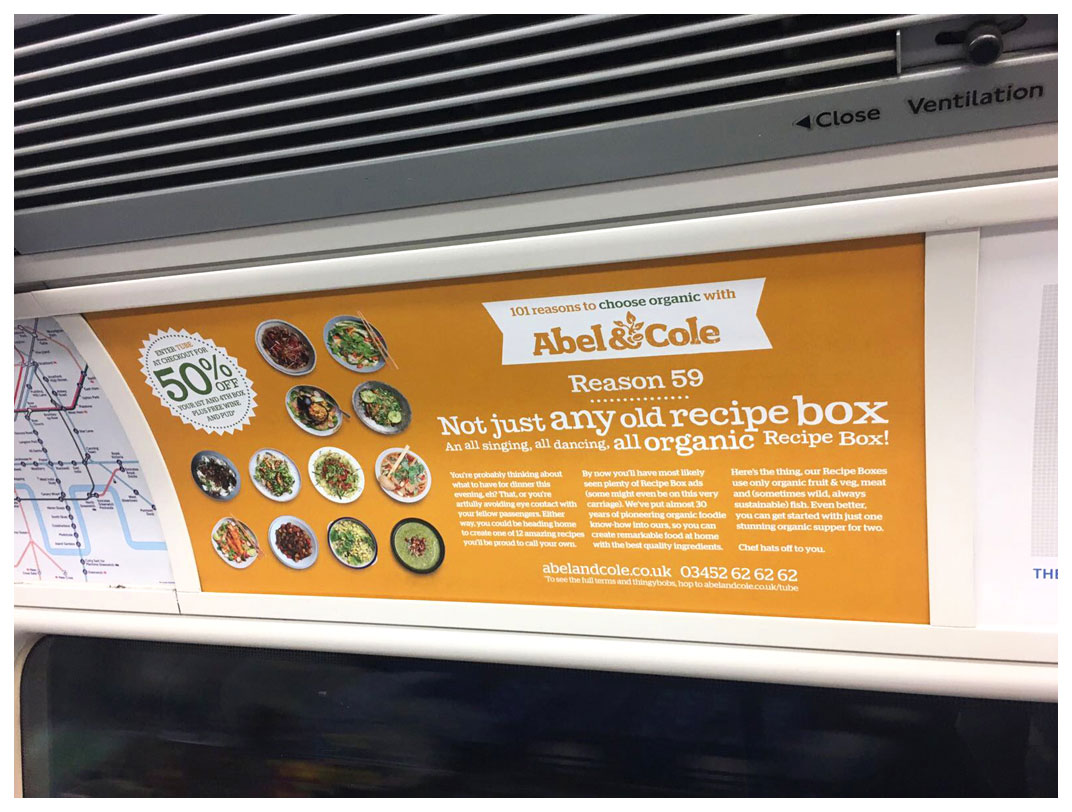 A photograph of a tube advert focussing on recipe boxes