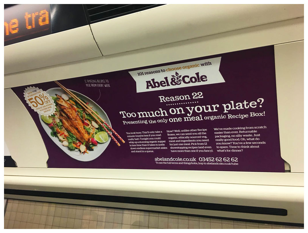 A photograph of a tube advert focussing on single meal recipe boxes