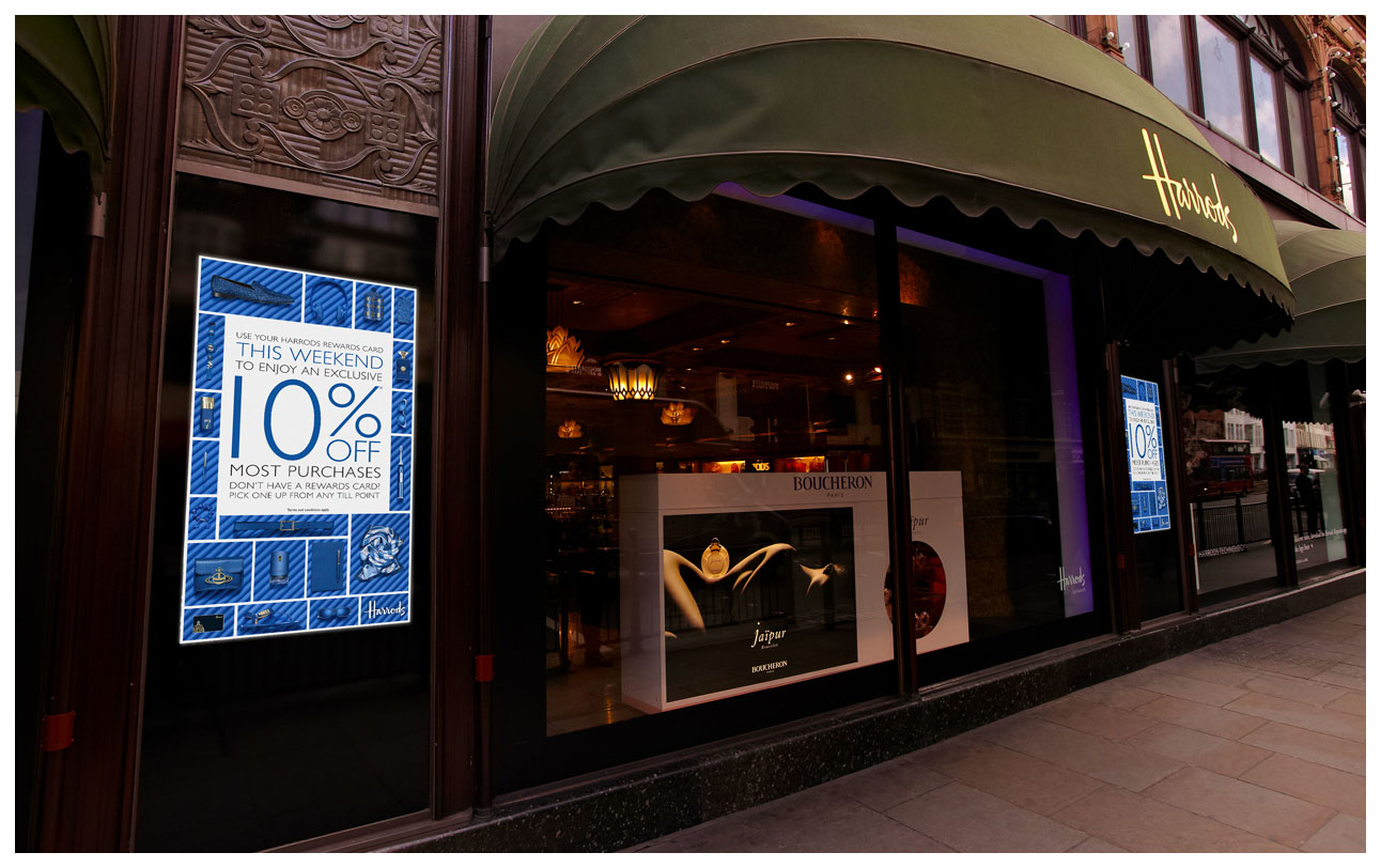 A photograph of the campaign advertised on plasma screens on the exterior of Harrods with blue products on matching blue pipes