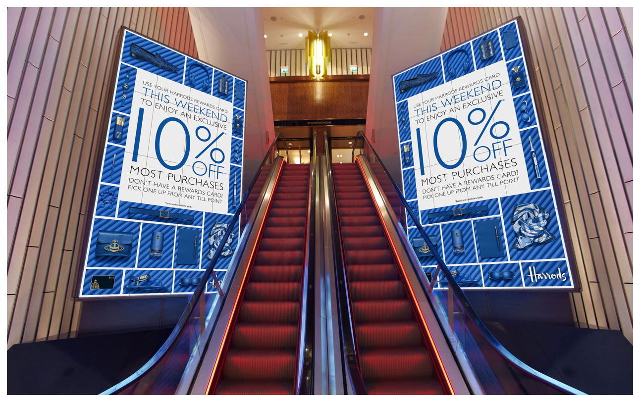 A photograph of the campaign on huge plasma screens in Harrods with blue products on matching blue pipes