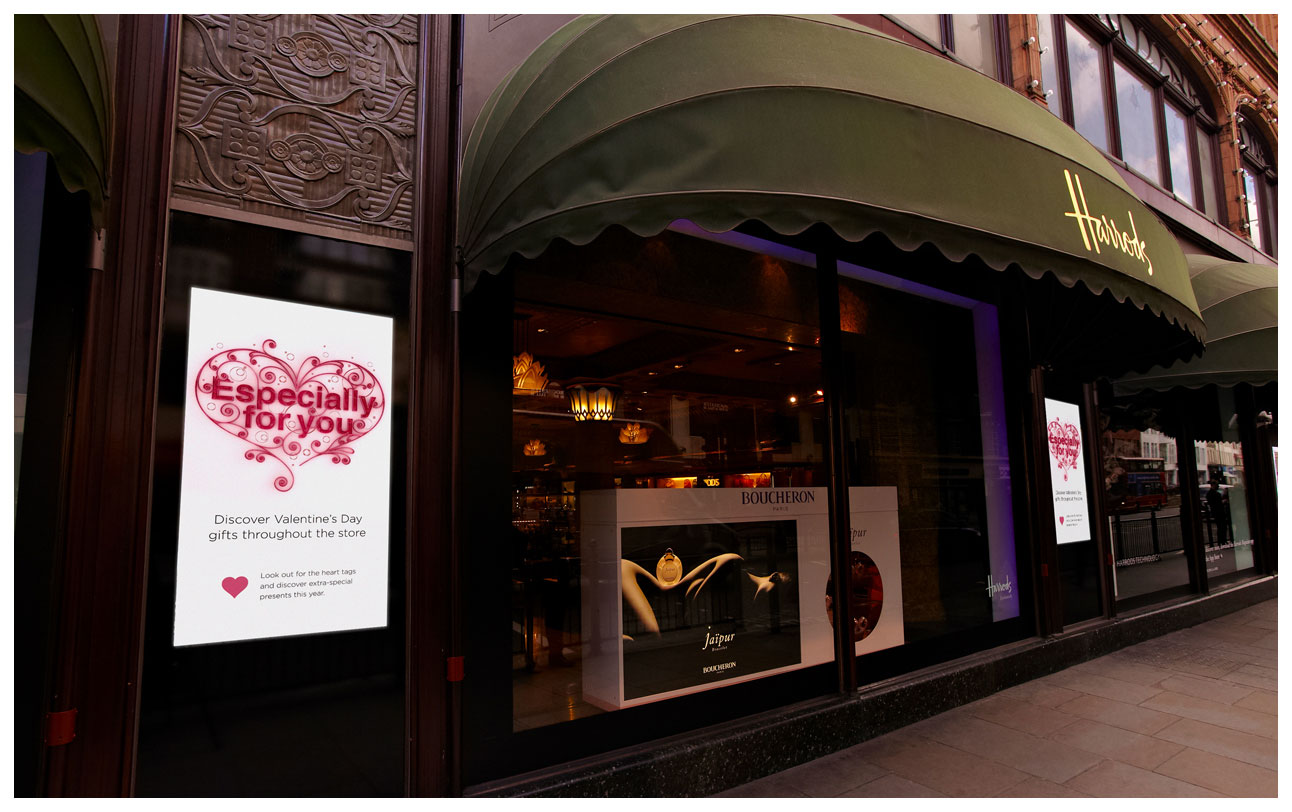 Photograph showing plasma screens shown on the exterior of Harrods